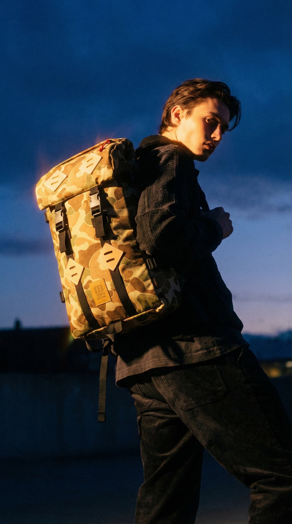 AI product shot of Topo Designs Limited Edition Duck Camo Klettersack