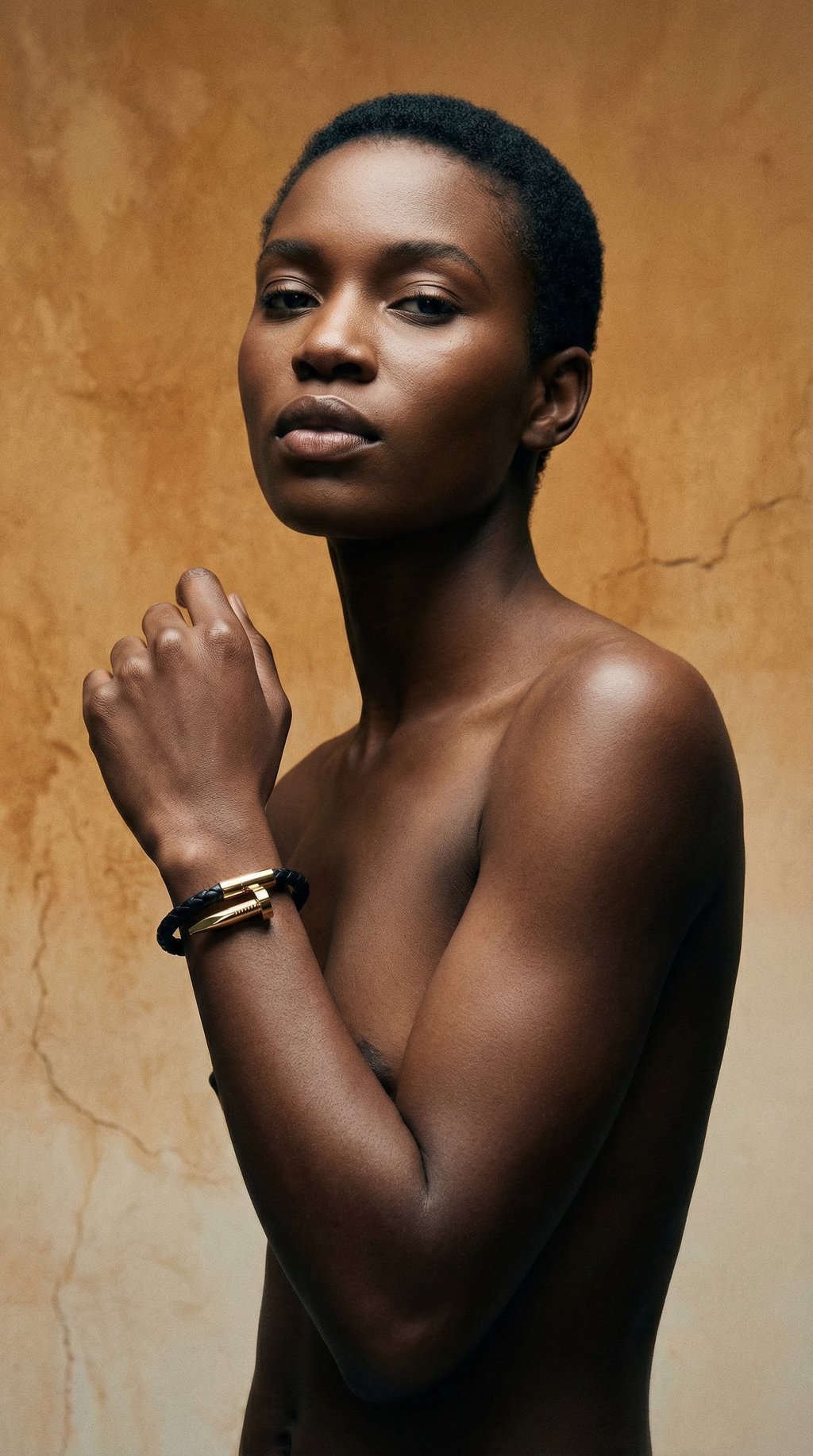 AI product shot of Black Braided Leather & Gold Nail