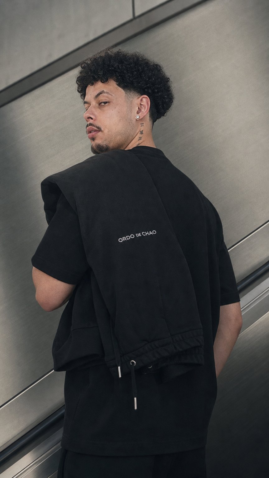 AI product shot of ORDO DE CHAO Black Track Pants