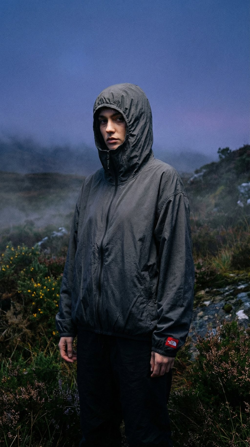 AI product shot of The North Face TNF Red Box Packable Hooded Wind Jacket