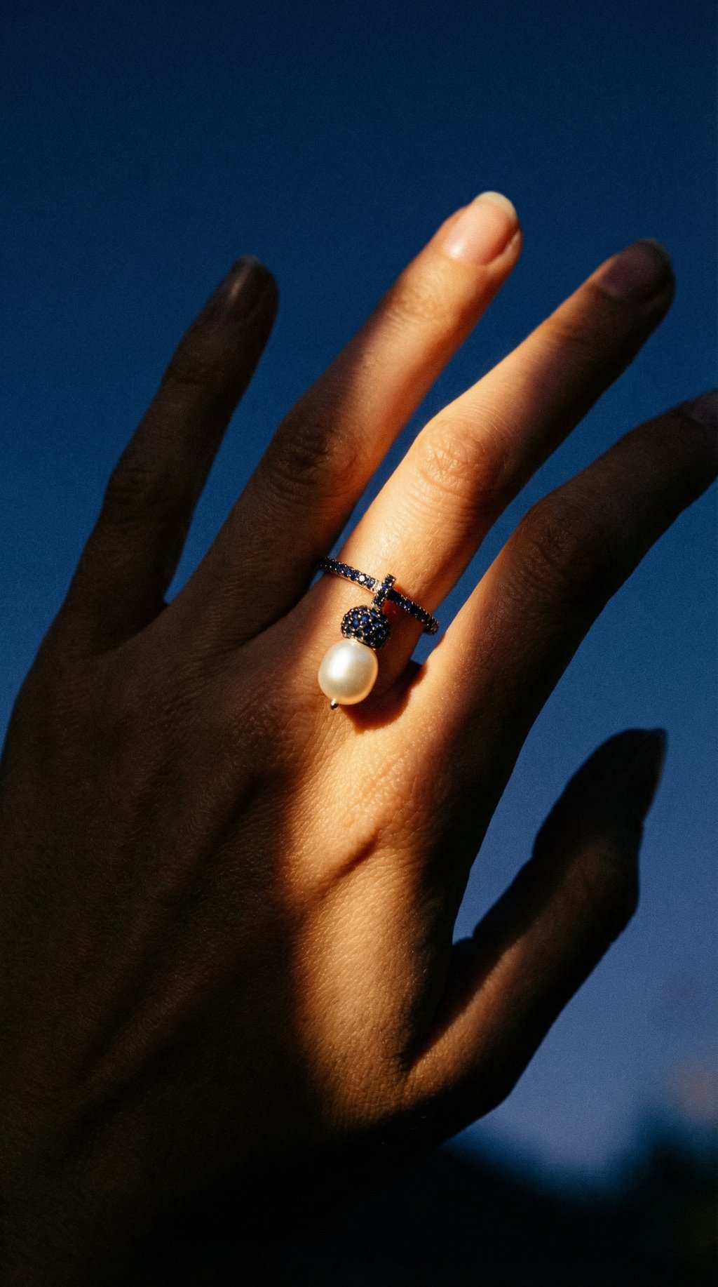 AI product shot of Unique Edition White Gold, Blue Sapphire Pearl ring