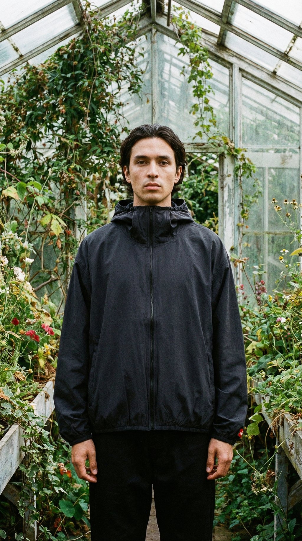 AI product shot of The North Face TNF Red Box Packable Hooded Wind Jacket