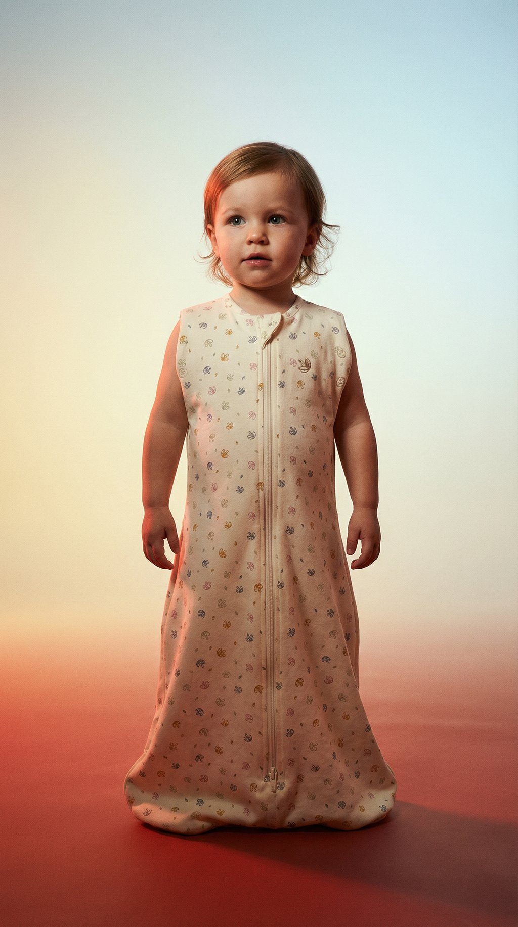 AI product shot of Swaddle Sleeping Bag in Rainbow Dreaming | 0.5 TOG