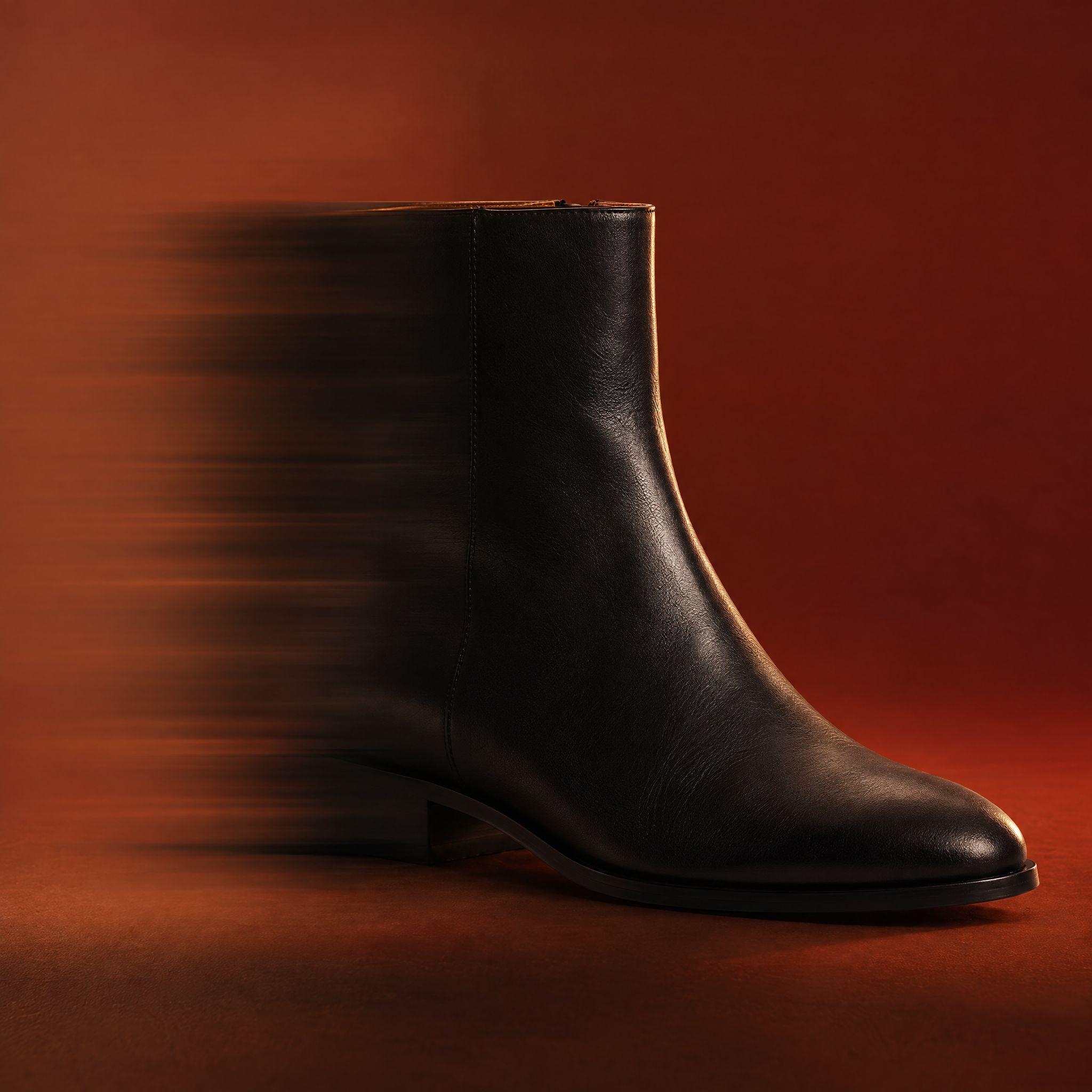 Black suitcase in motion blur against a red backdrop, and the same shot with a black leather ankle boot in its place - After
