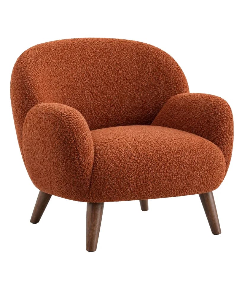 Rust bouclé armchair with wooden legs and a soft floor shadow, and the same chair on a pure white background without the shadow - After
