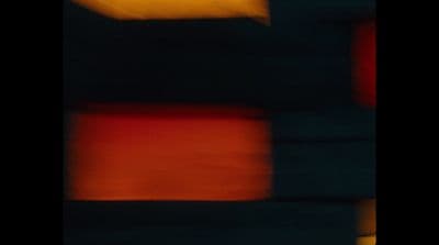 a blurry image of a red and black object