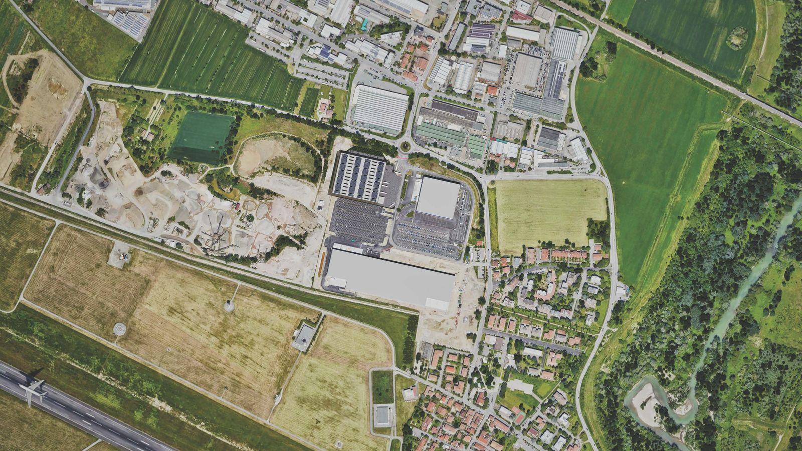 an aerial view of a city with lots of grass