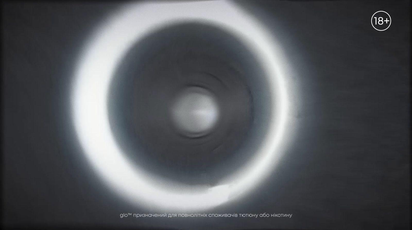 a black and white photo of a circular object