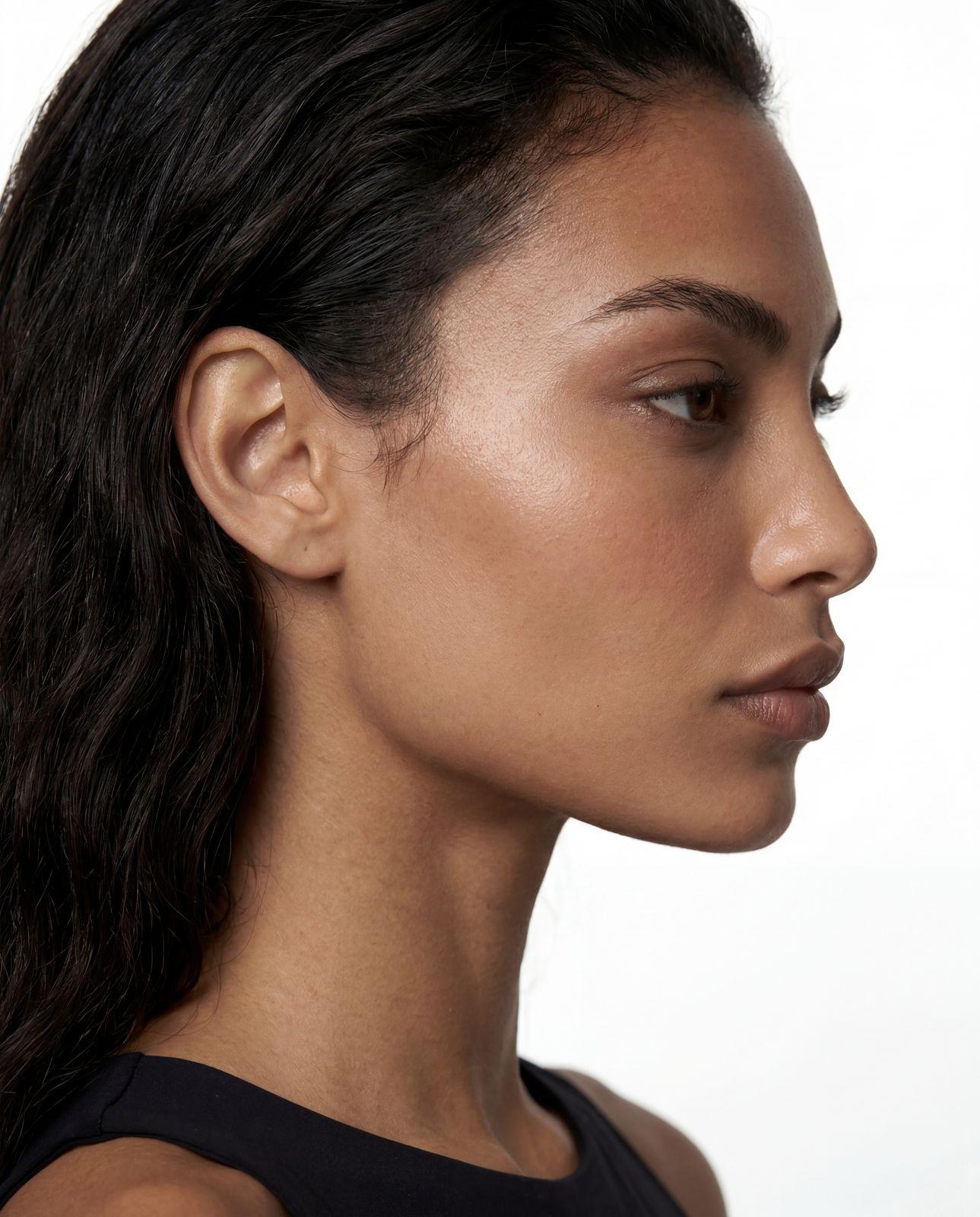 a close up of a woman with a ponytail