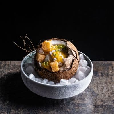 a bowl of food that is on a table