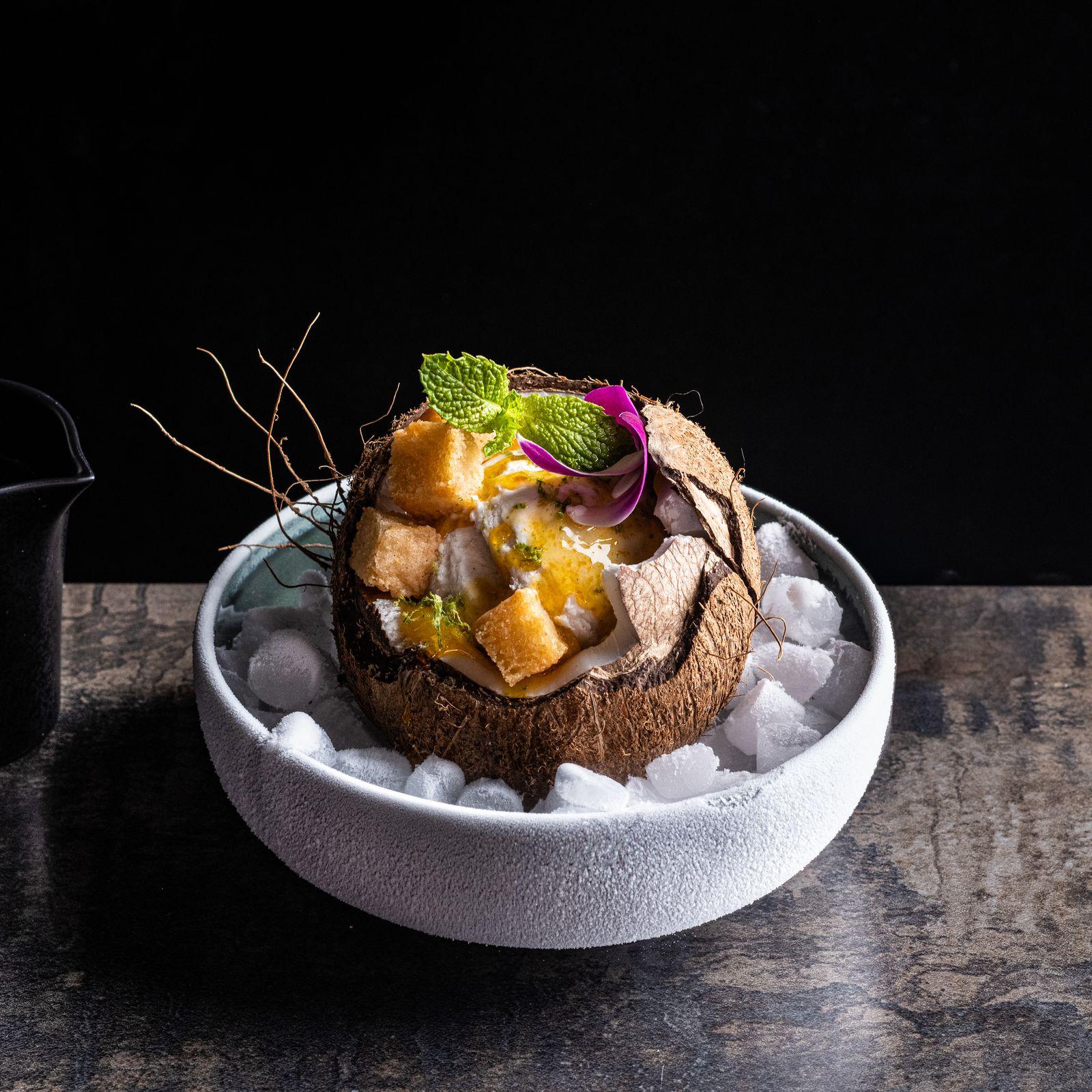 a bowl of food on a wooden table