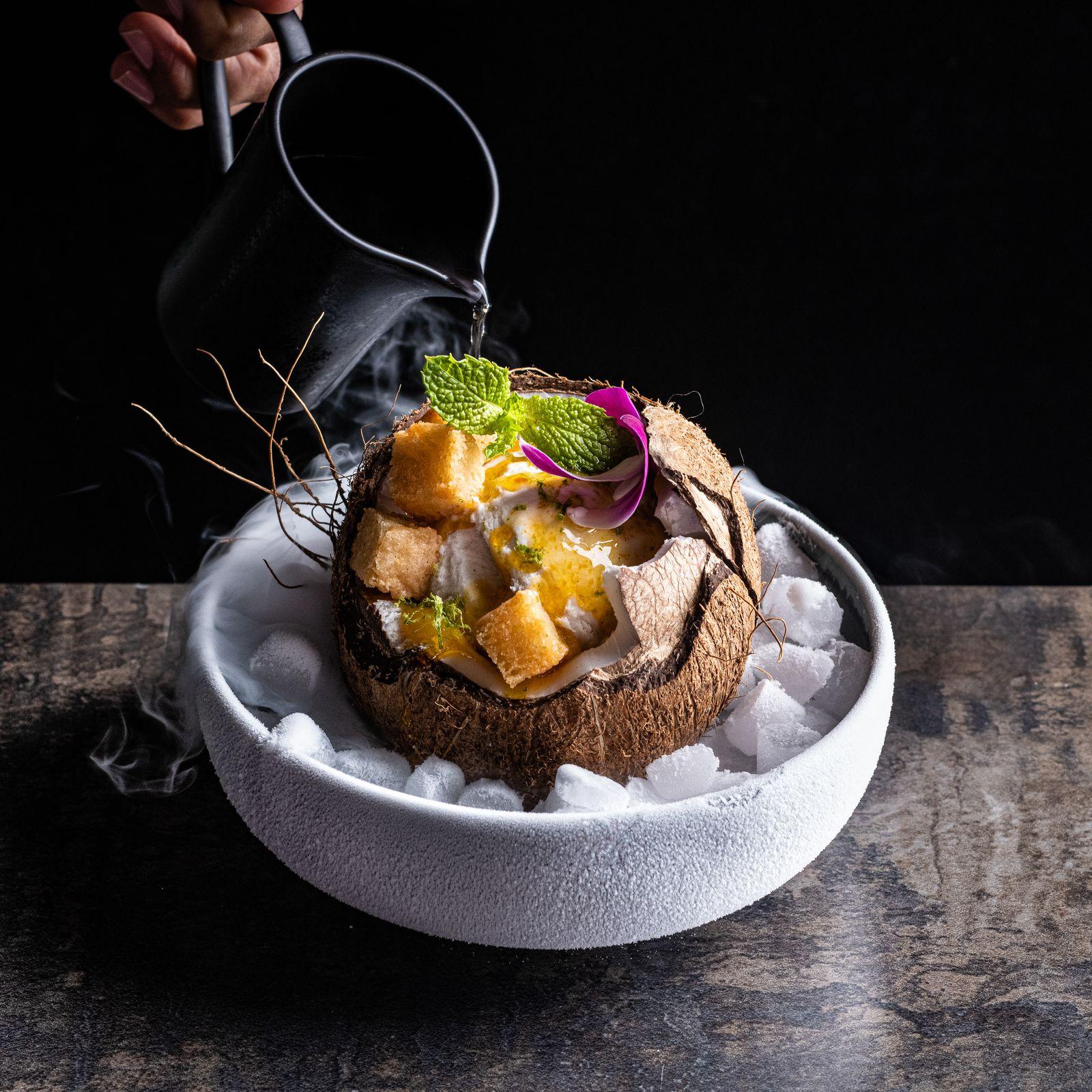 a bowl of food on a wooden table