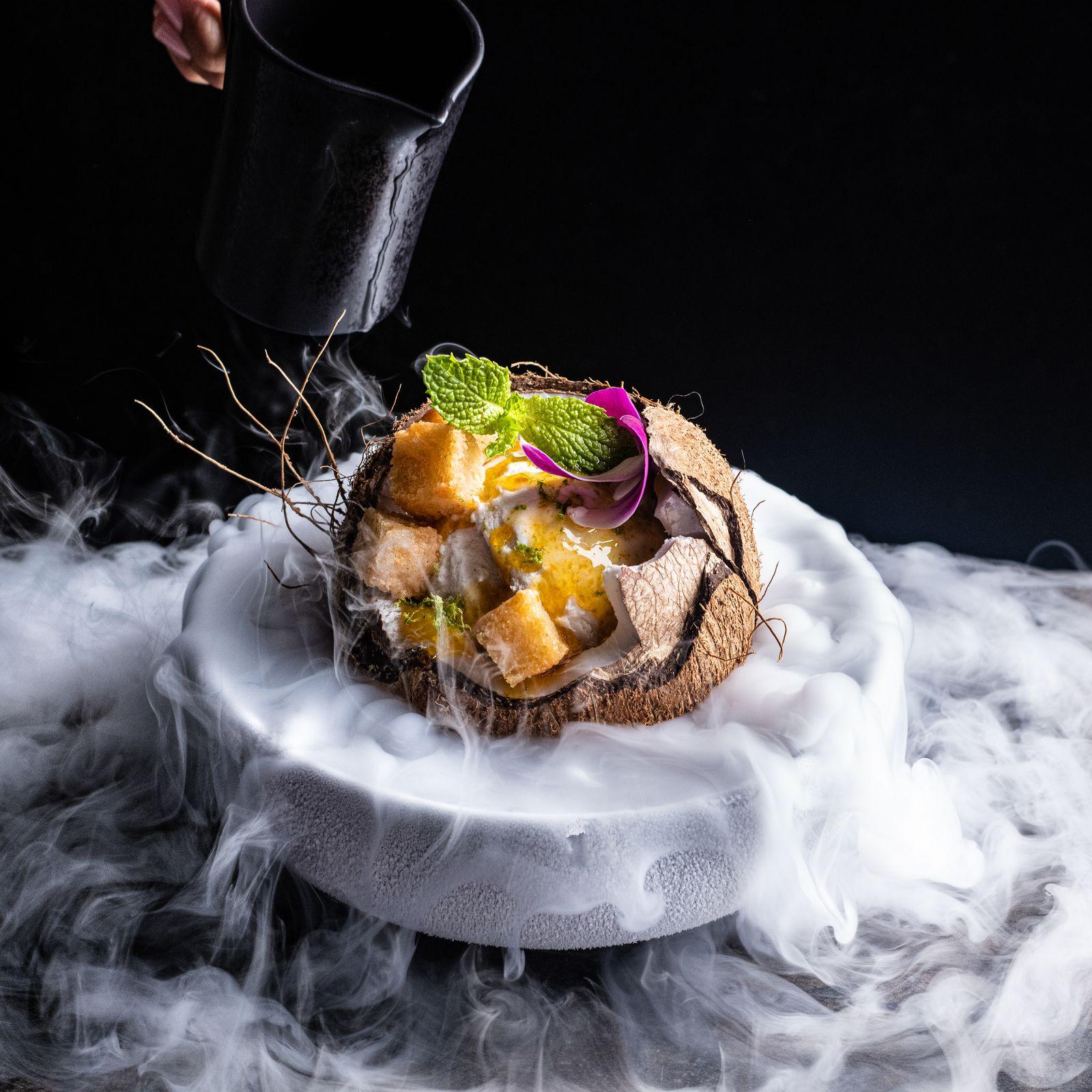 a plate of food with smoke coming out of it