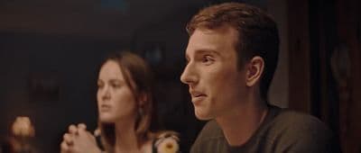a man and a woman sitting next to each other