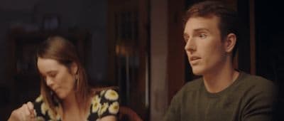 a man and a woman sitting at a table