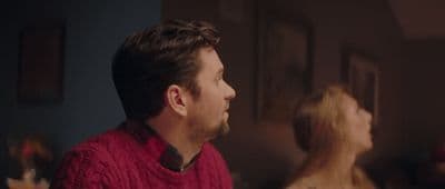 a man in a red sweater and a woman in a red sweater