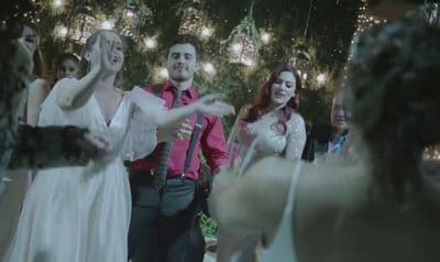 a group of people standing around each other