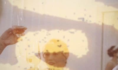 a reflection of a child in a mirror