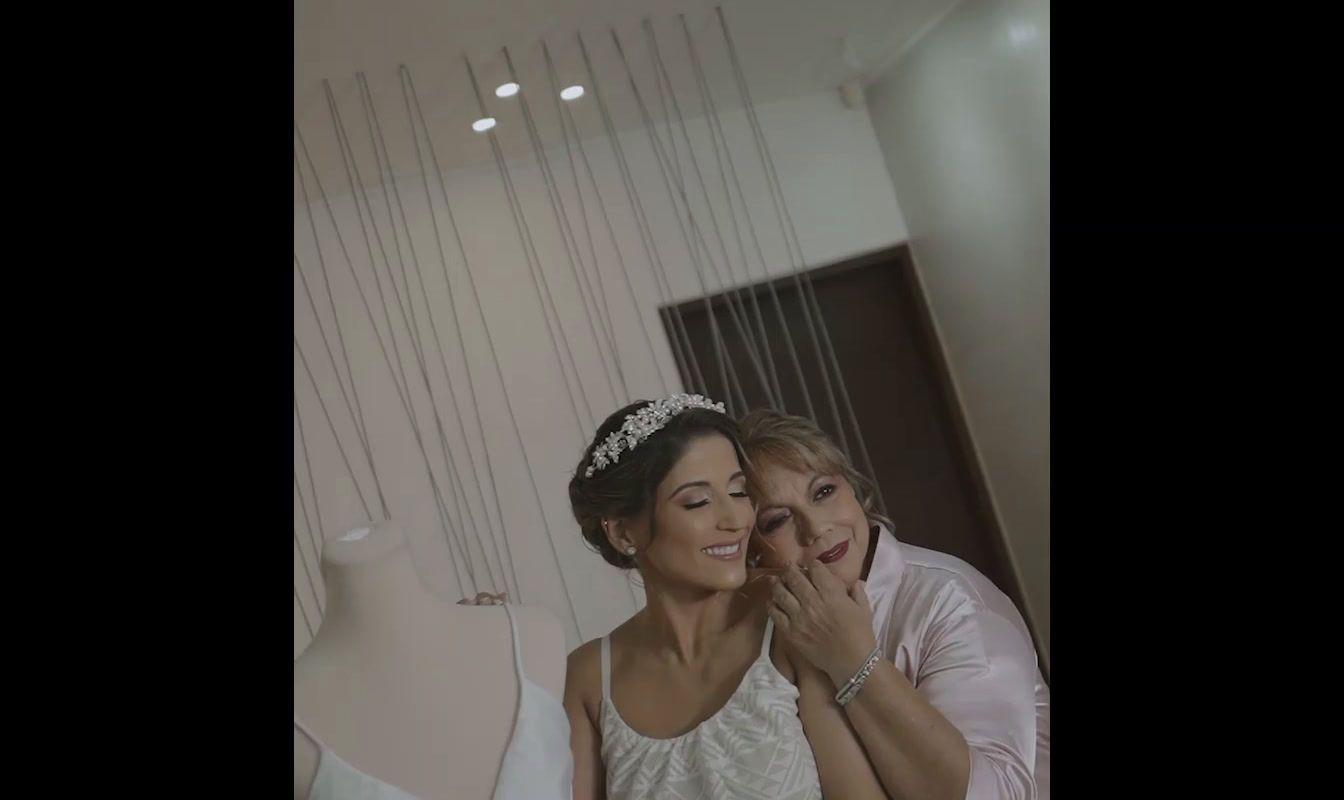 a bride and her mother are posing for a picture