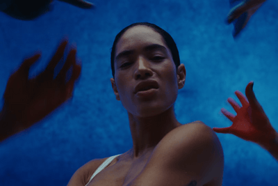 a woman with her hands in the air