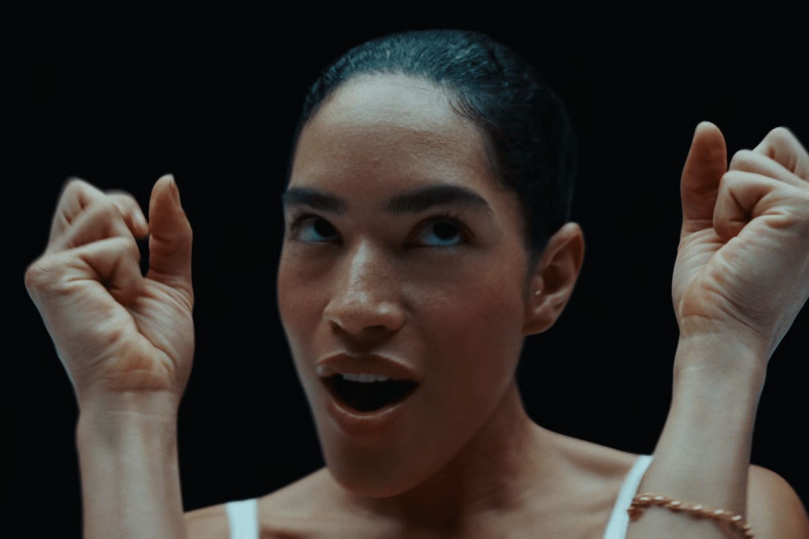 a woman with her hands in the air