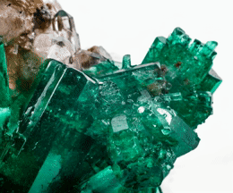 a cluster of green crystals sitting on top of each other