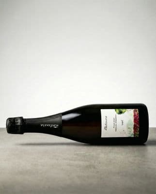 a bottle of wine sitting on top of a table