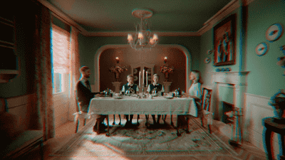 a group of people sitting at a table in a room