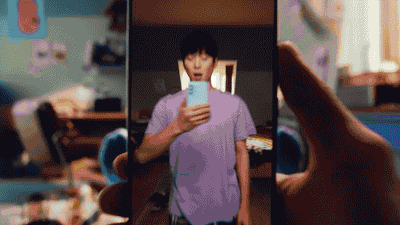 a man taking a picture of himself in a mirror