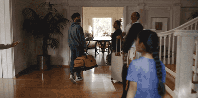 a group of people standing in a living room