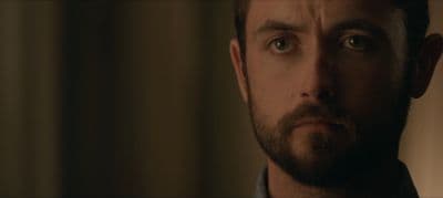 a close up of a person with a beard