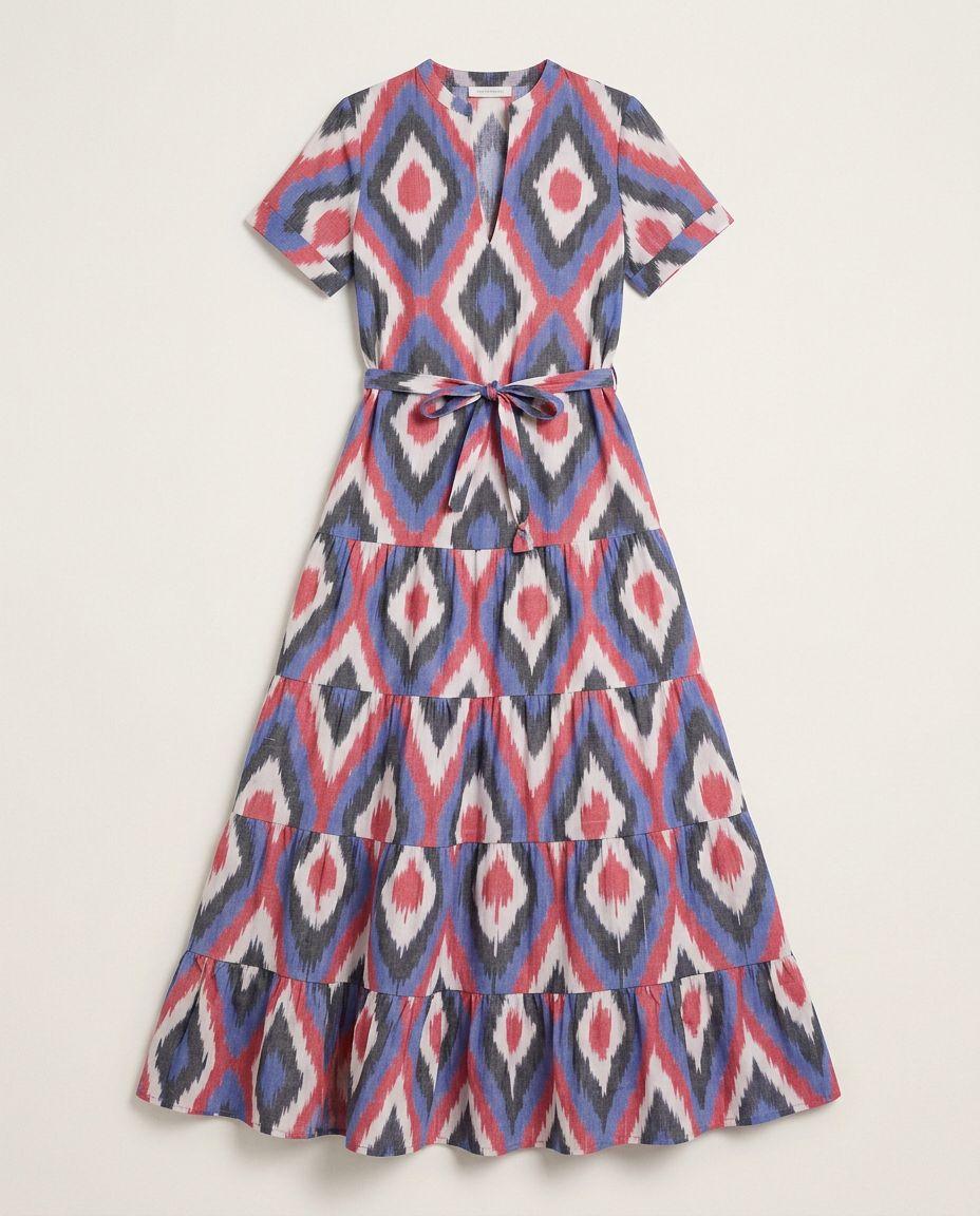 a blue and red dress with a bow at the waist