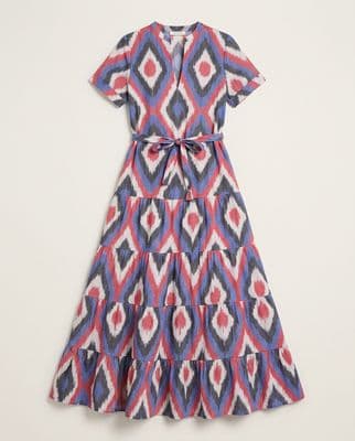 a blue and red dress with a bow at the waist