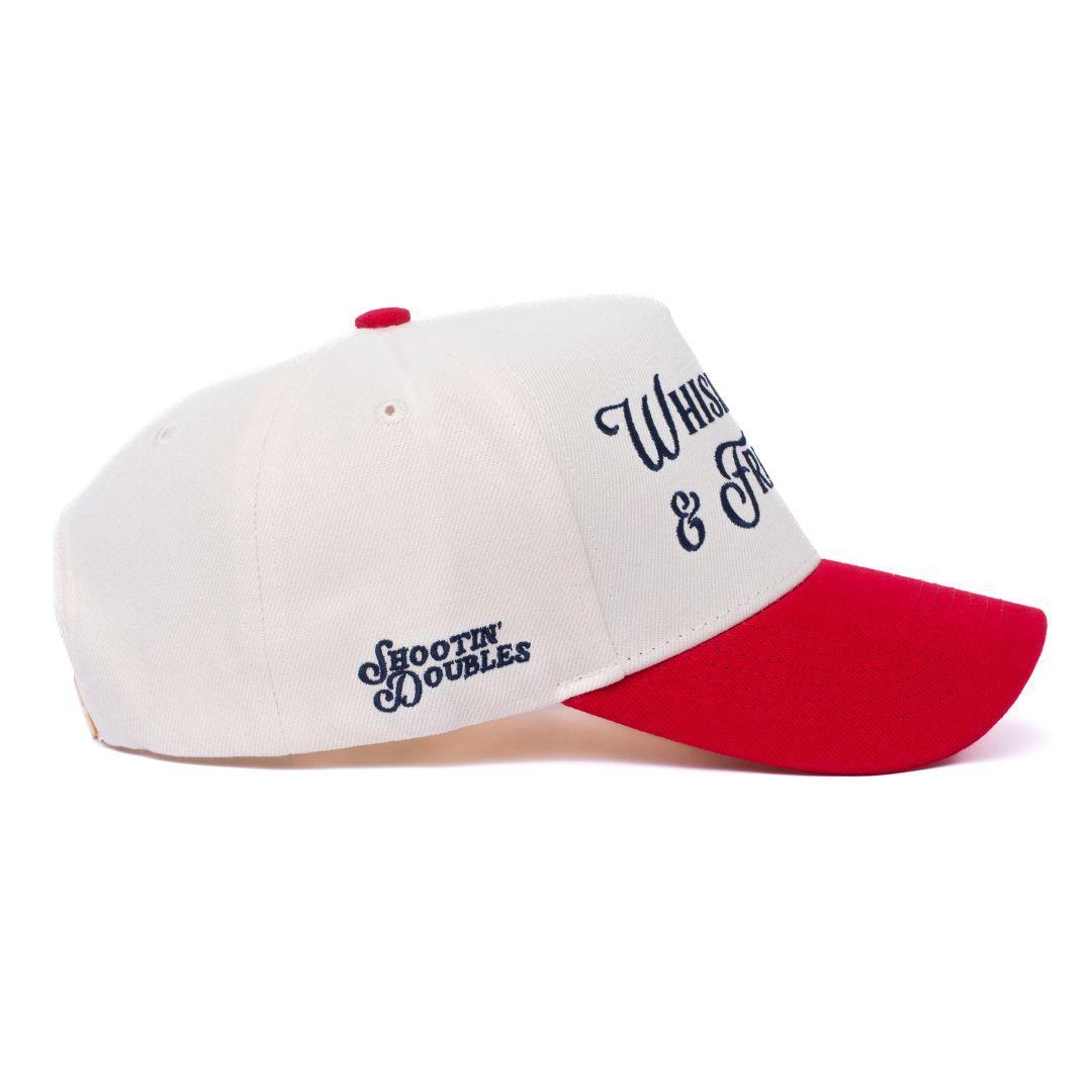 a white and red hat with a red peak