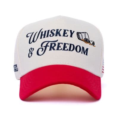 a white and red hat with the words whiskey and freedom on it