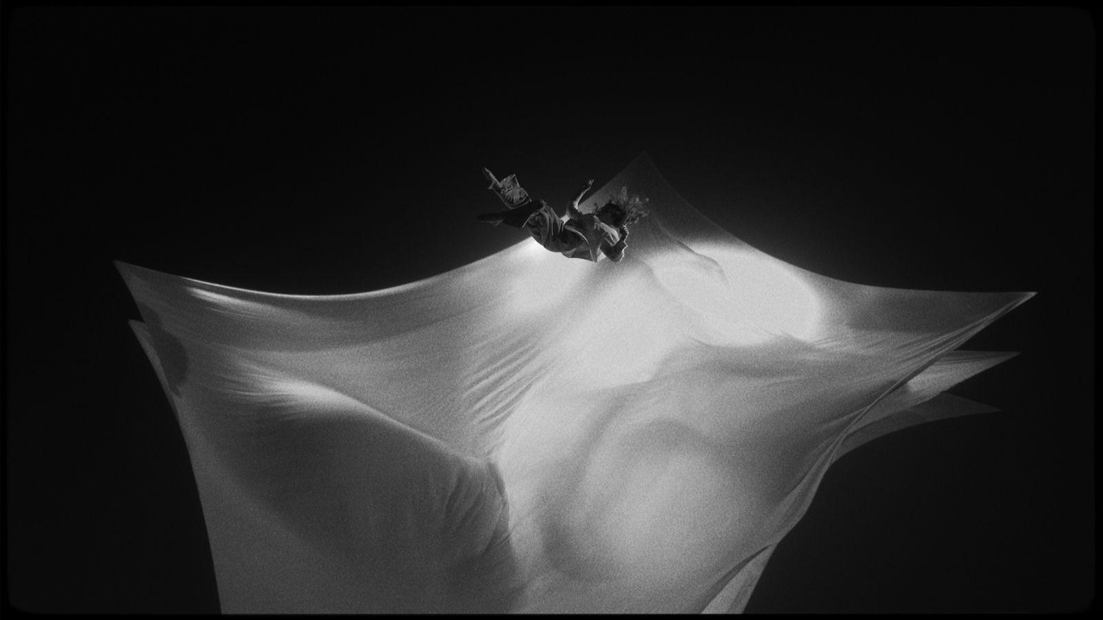 a black and white photo of a flower