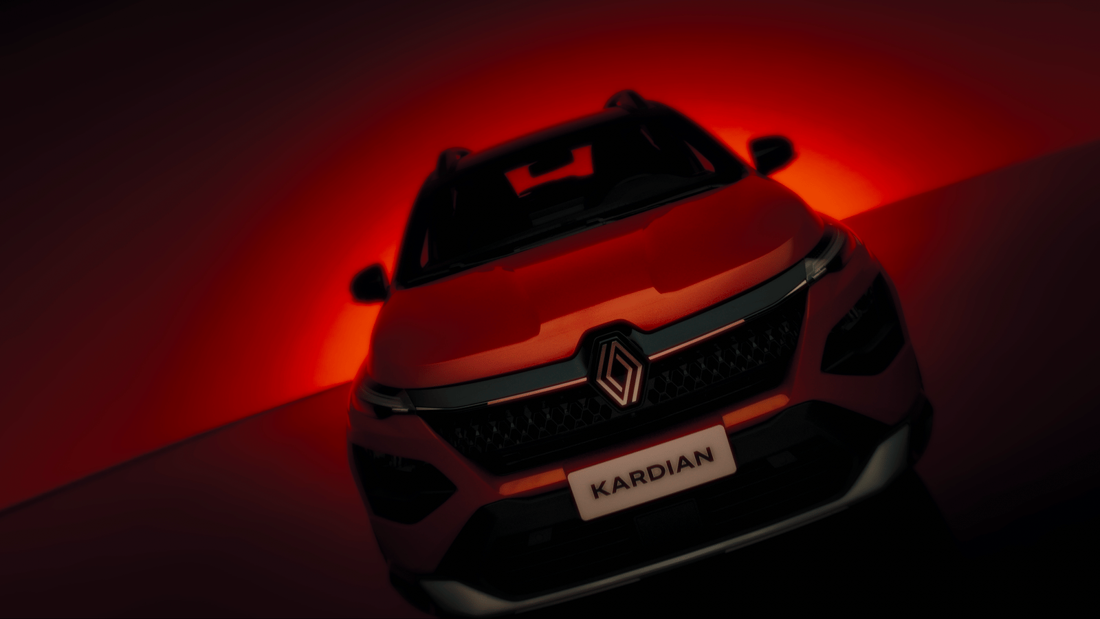 the front of a red car with a red light behind it