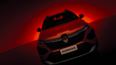 the front of a red car with a red light behind it