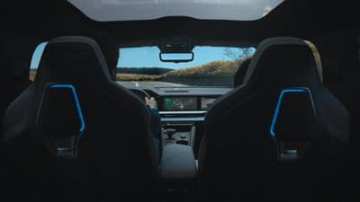 the interior of a vehicle with a view of a field
