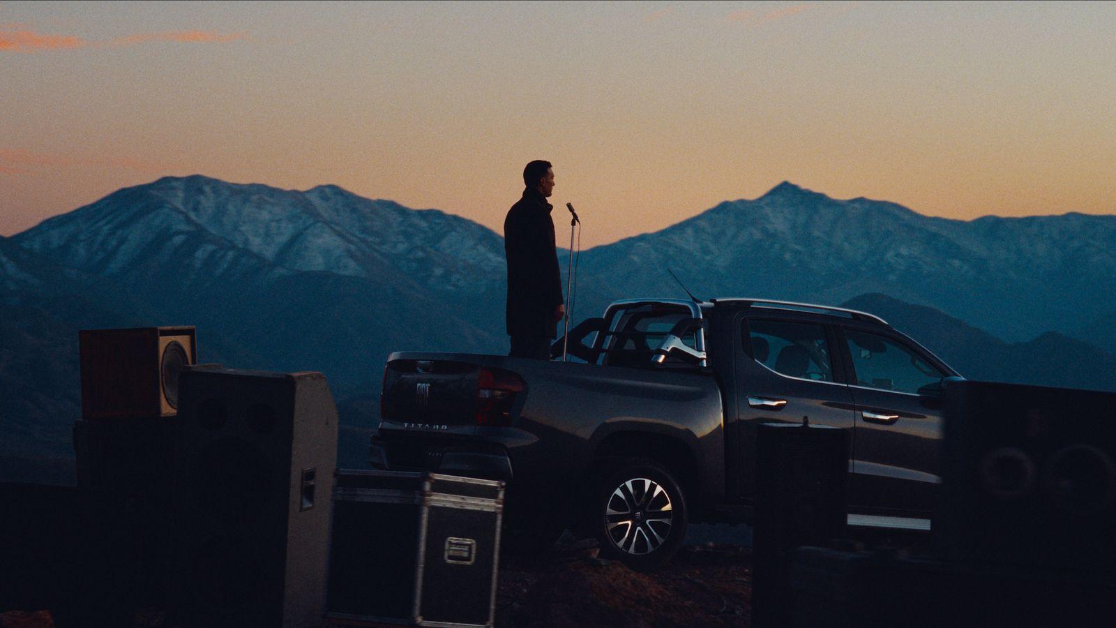 a man standing on top of a truck