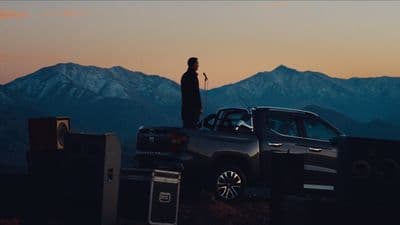 a man standing on top of a truck