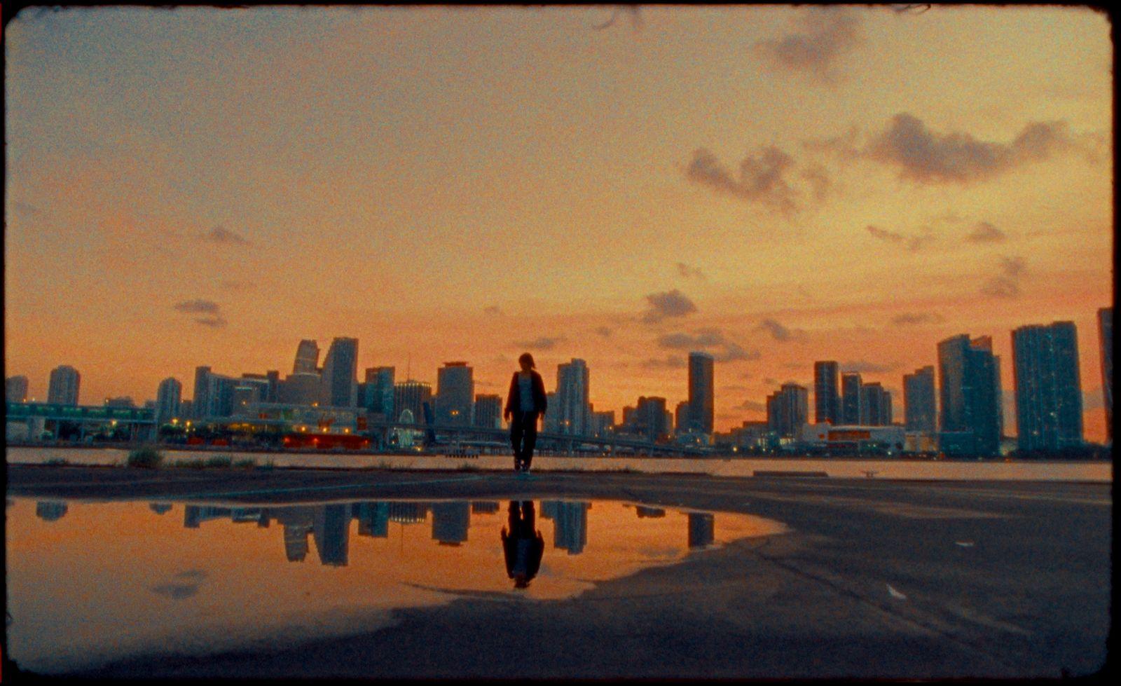 a person standing in front of a body of water