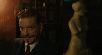 a man with a fake moustache on his face