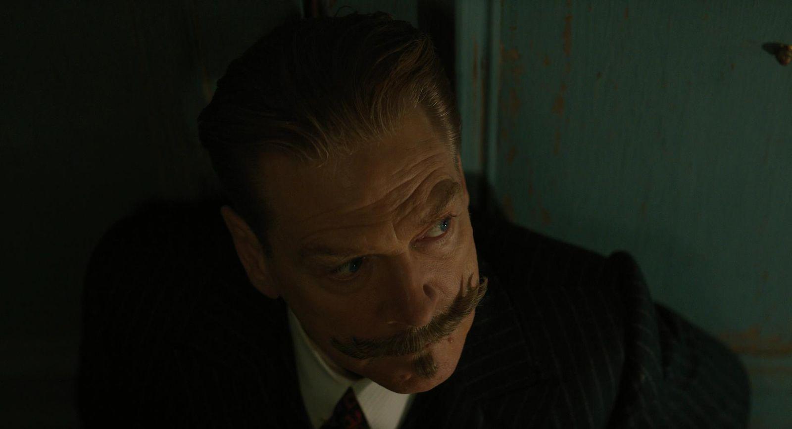 a man with a moustache and a moustache on his face