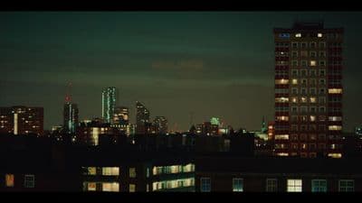 a view of a city at night from a rooftop