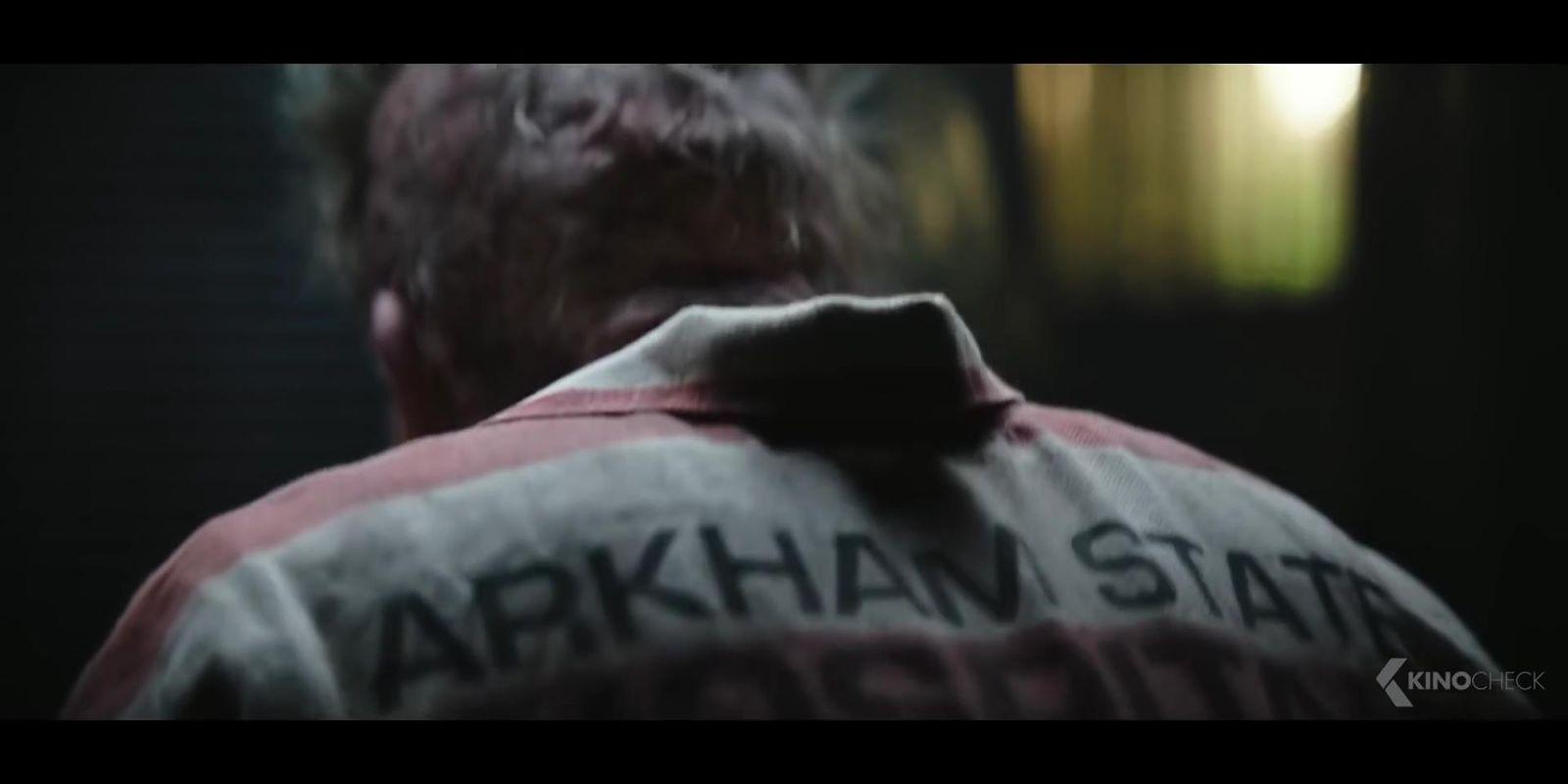 the back of a man's jacket with the words arkhan state on it