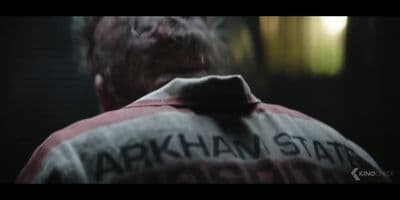 the back of a man's jacket with the words arkhan state on it