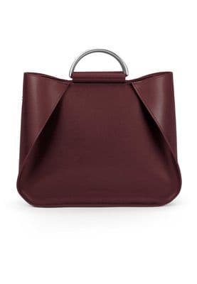 a red handbag with a metal handle