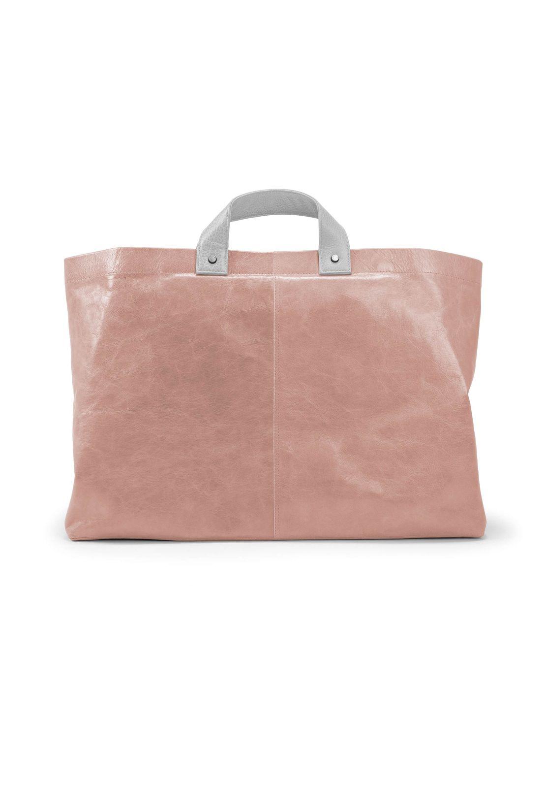 a pink leather bag with a handle on a white background