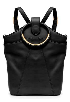 a black handbag with a circular handle